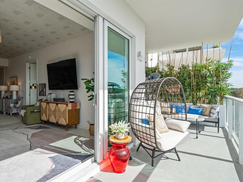 1020 Sunset Point Road, Unit 511 Clearwater, FL 33755 - Photo 82 of 99 a living room filled with furniture and a flat screen tv