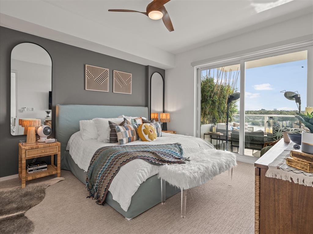 1020 Sunset Point Road, Unit 511 Clearwater, FL 33755 - Photo 86 of 99 a bedroom with a bed and wooden floor