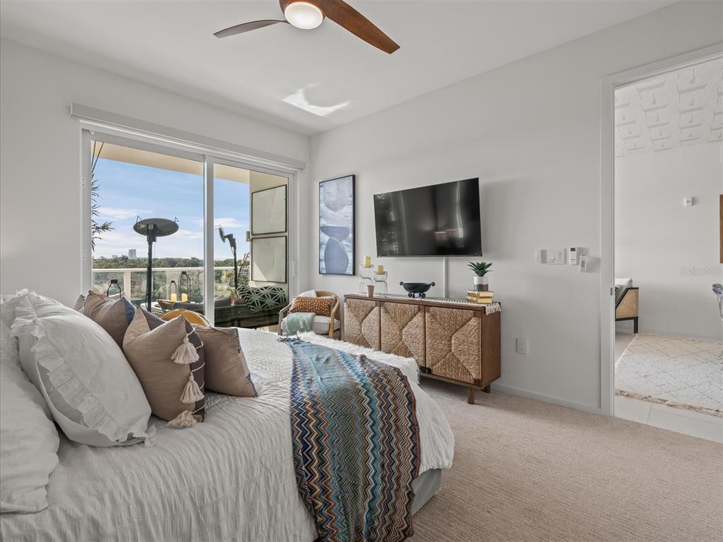 1020 Sunset Point Road, Unit 511 Clearwater, FL 33755 - Photo 87 of 99 a living room with furniture and a flat screen tv