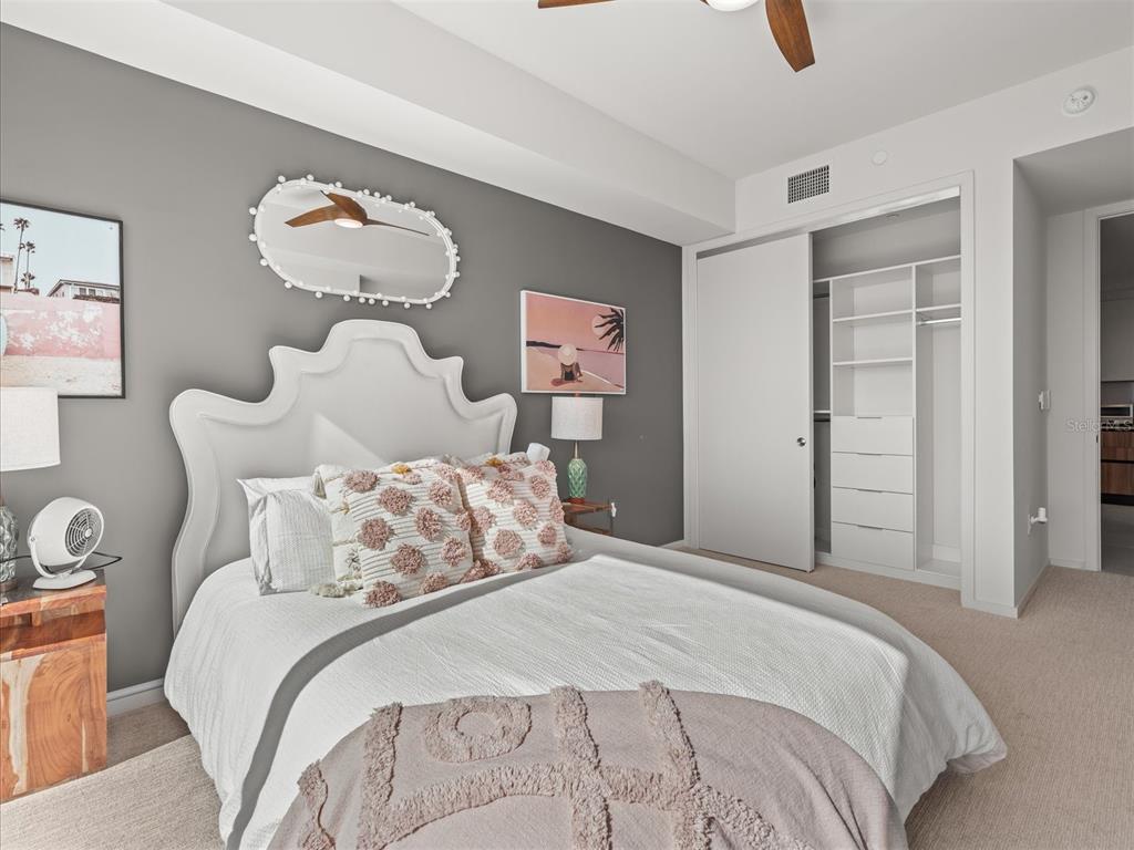 1020 Sunset Point Road, Unit 511 Clearwater, FL 33755 - Photo 96 of 99 a bedroom with bed and wooden floor