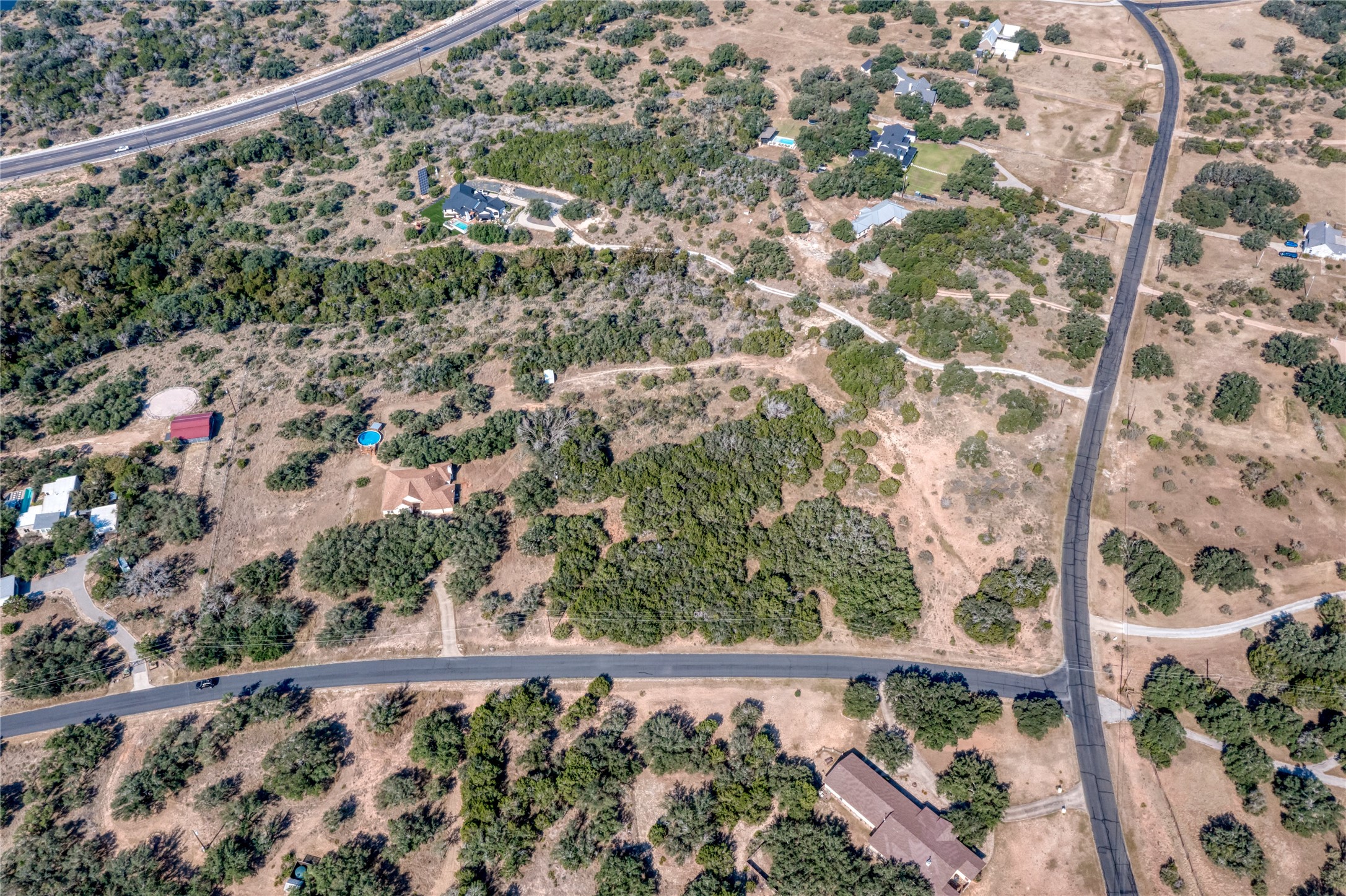 2600 Indian Divide Road Spicewood, TX 78669 - Photo 17 of 25 Aerial overview of property's location with a desert landscape and rural landscape