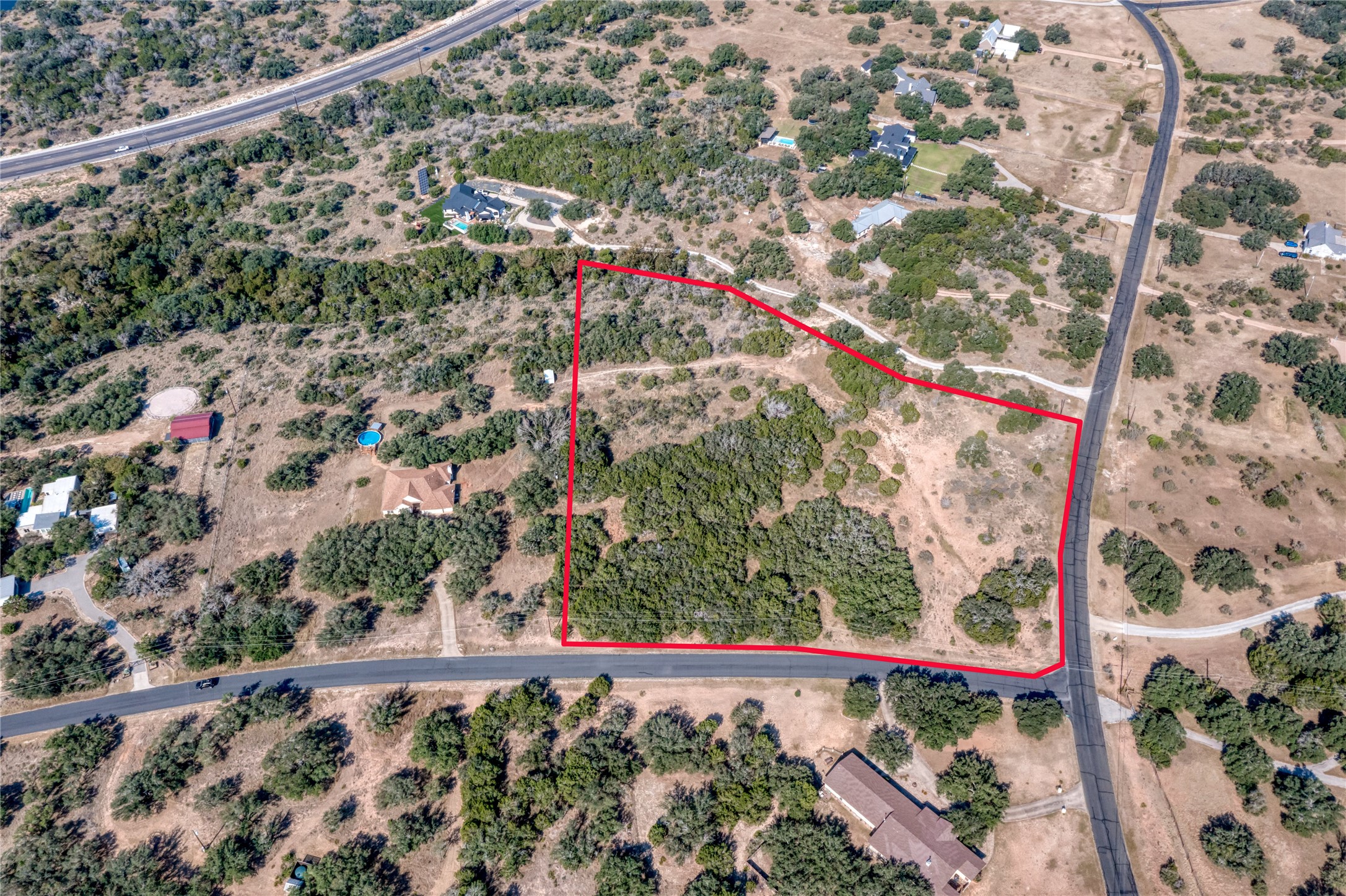 2600 Indian Divide Road Spicewood, TX 78669 - Photo 2 of 25 View of rural area with a desert landscape and property boundaries highlighted