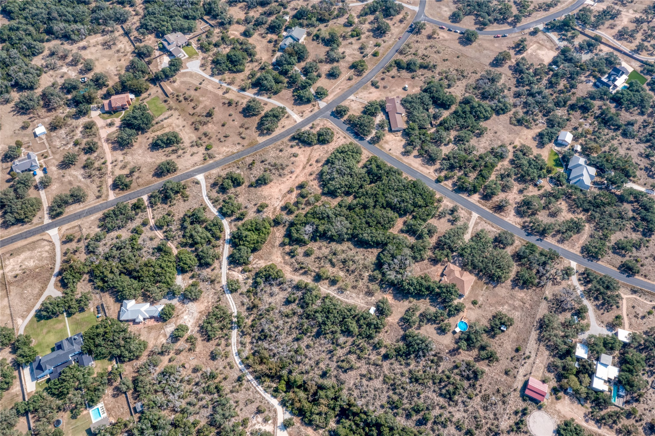 2600 Indian Divide Road Spicewood, TX 78669 - Photo 22 of 25 Aerial view of property and surrounding area with rural landscape