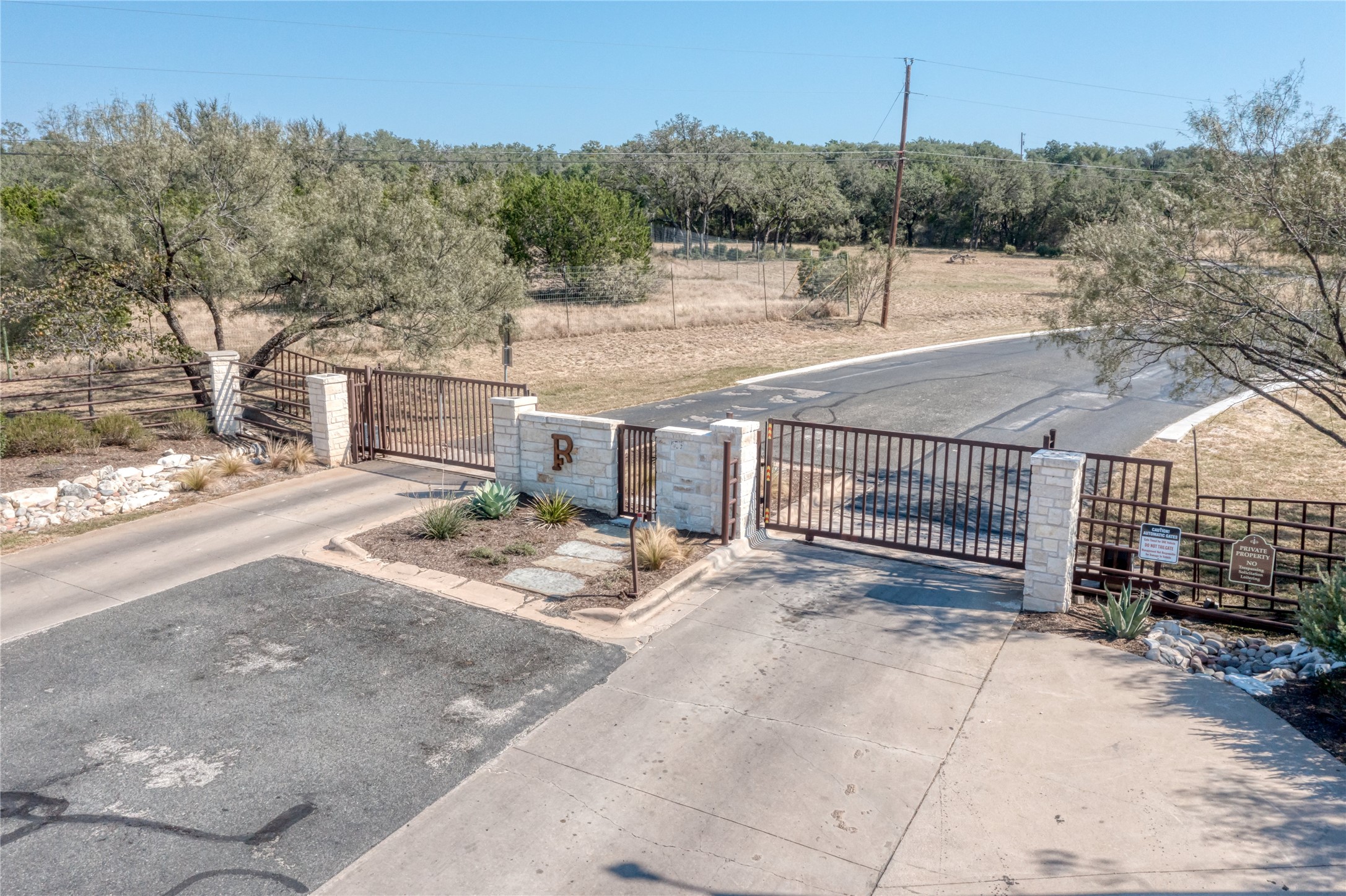2600 Indian Divide Road Spicewood, TX 78669 - Photo 25 of 25 Gate featuring view of scattered trees and a rural view