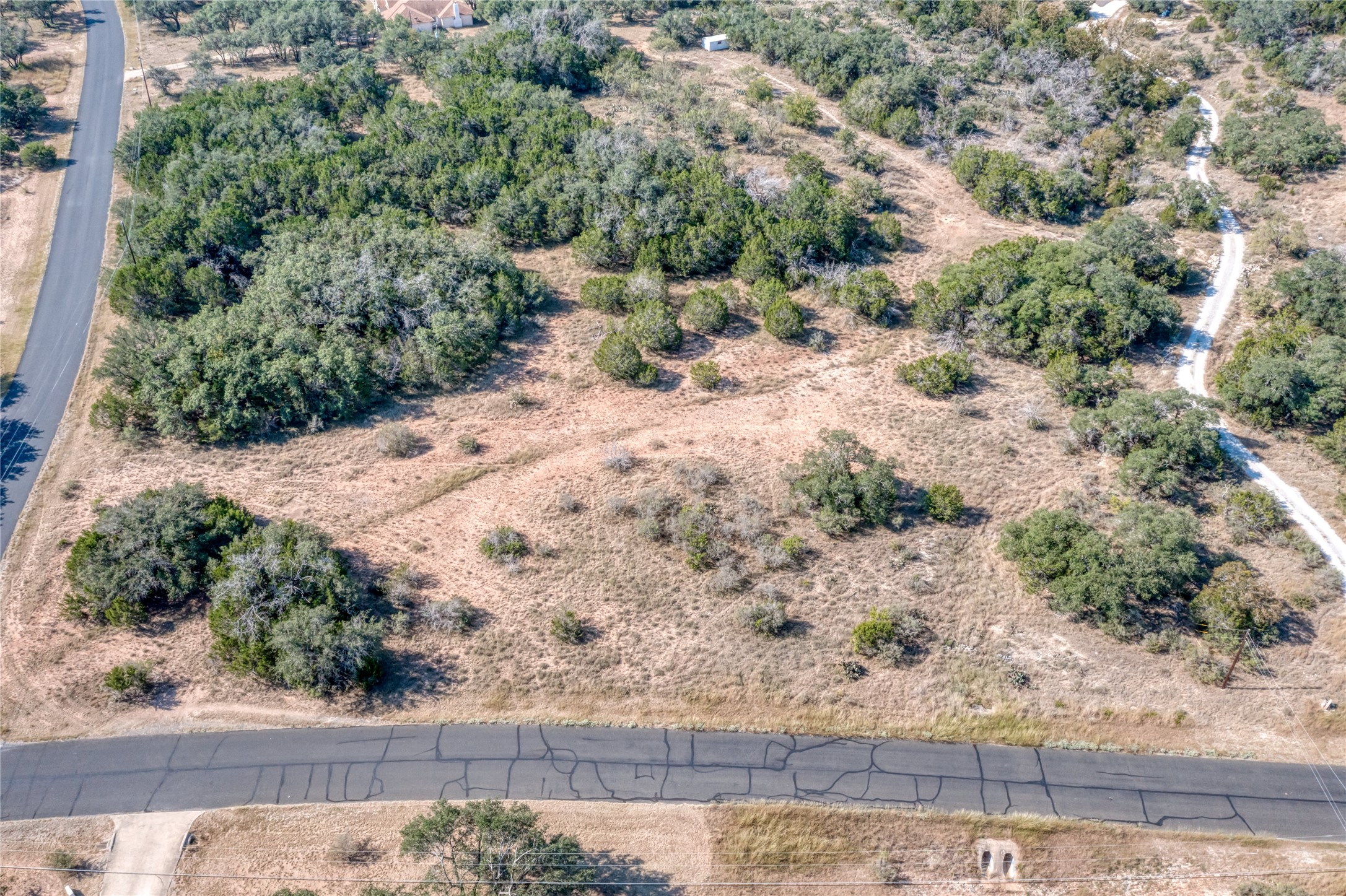 2600 Indian Divide Road Spicewood, TX 78669 - Photo 6 of 25 Aerial view of property and surrounding area featuring rural landscape
