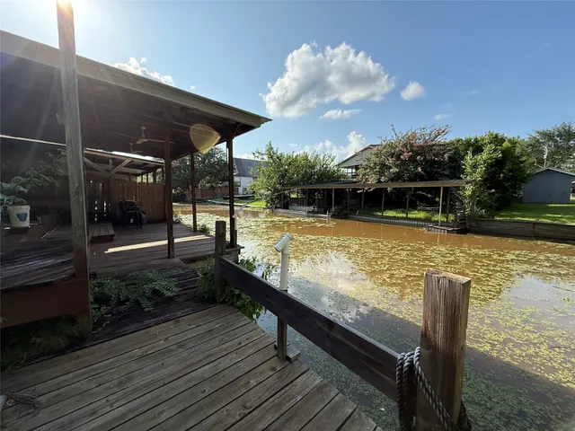 a view of a swimming pool with seating space