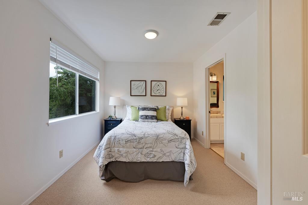4542 Thomas Road Sebastopol, CA 95472 - Photo 24 of 60 a bedroom with a bed and window
