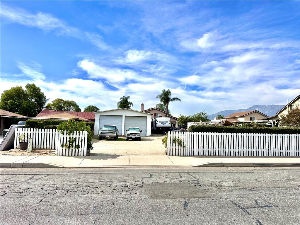 1094 North Linden Avenue Rialto, CA 92376 - Photo 1 of 8 a view of a wrought iron fences in front of house