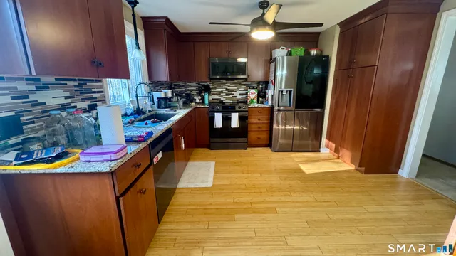 a kitchen with lots of counter space and appliances