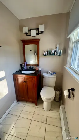 a room with a washing machine and cabinets