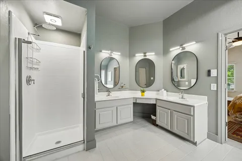 a white bath tub sitting in a spacious bathroom