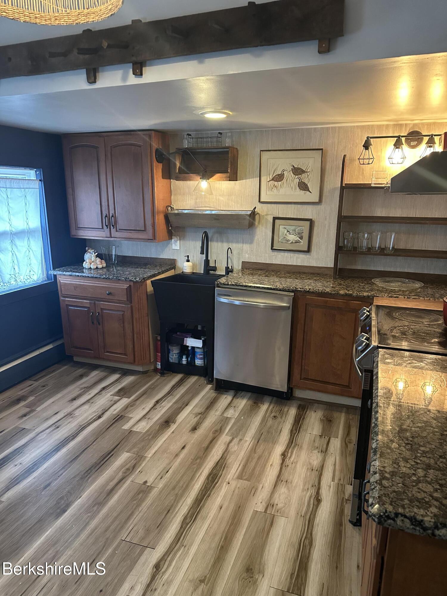 27 North Main Road Otis, MA 01253 - Photo 5 of 24 a room with granite countertop lots of wooden furniture