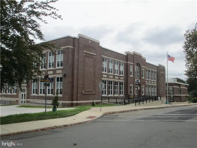 a view of a building with a street