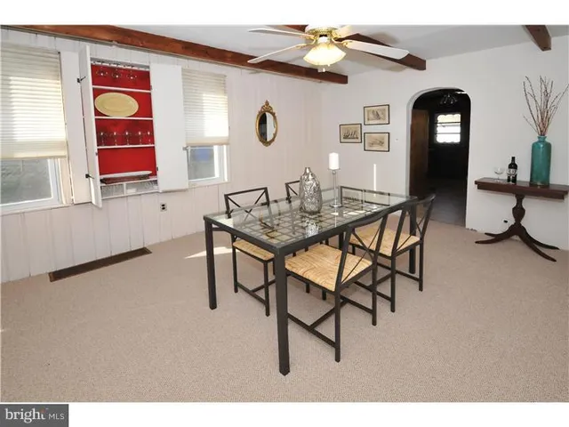 a view of a livingroom with furniture and window