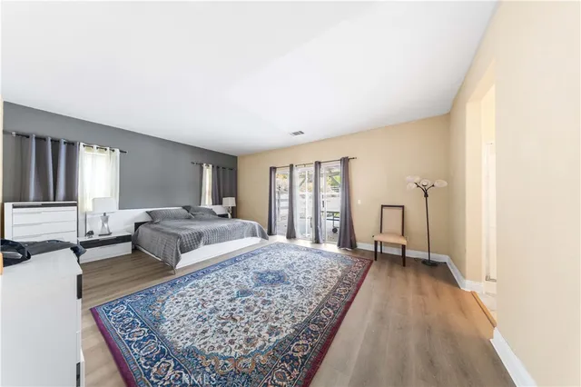 a living room with a couch and a rug