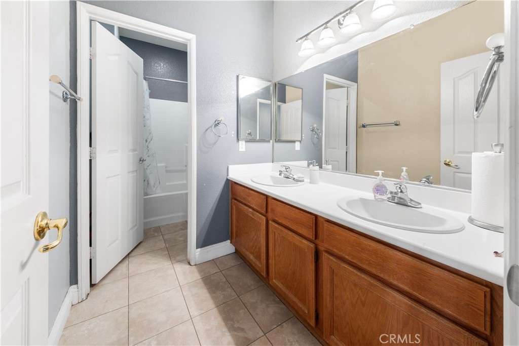34314 Desert Road Acton, CA 93510 - Photo 27 of 46 a spacious bathroom with a double vanity sink mirror and shower