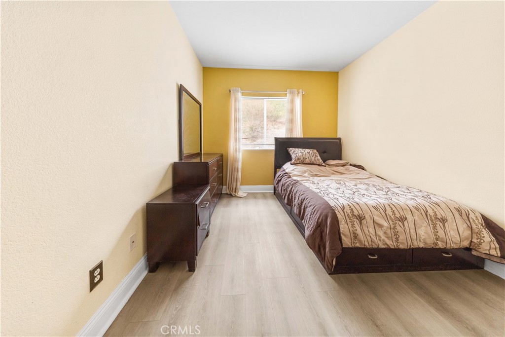 34314 Desert Road Acton, CA 93510 - Photo 30 of 46 a bed sitting in a bedroom next to a window