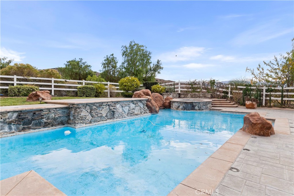 34314 Desert Road Acton, CA 93510 - Photo 35 of 46 a view of a swimming pool with an outdoor seating
