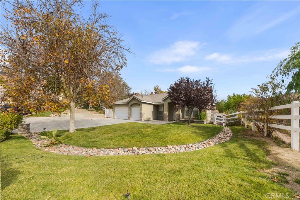34314 Desert Road Acton, CA 93510 - Photo 9 of 46 a view of a house with a big yard and large trees