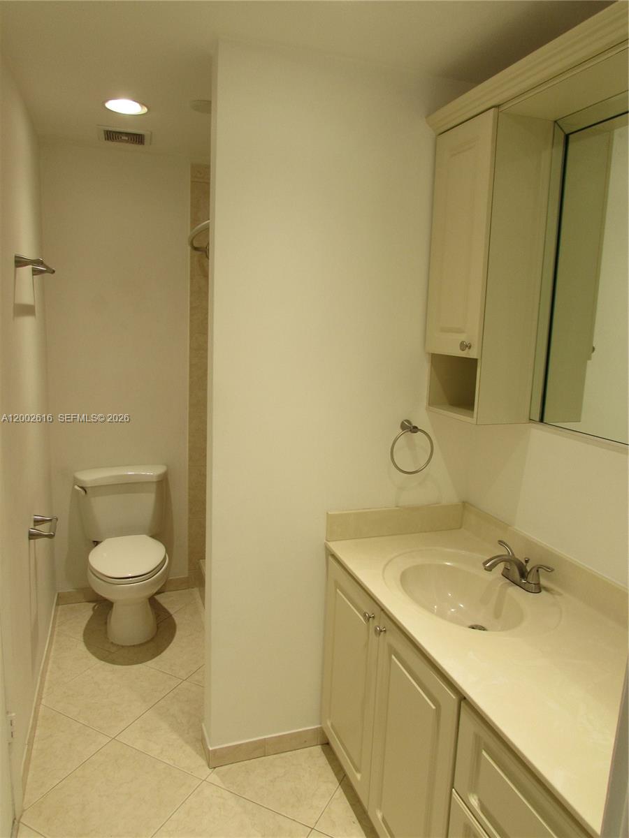 5555 Ludlam Road, Unit 23 South Miami, FL 33155 - Photo 18 of 25 a bathroom with a sink and a toilet
