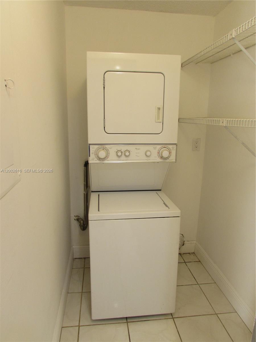 5555 Ludlam Road, Unit 23 South Miami, FL 33155 - Photo 23 of 25 a utility room with dryer and washer