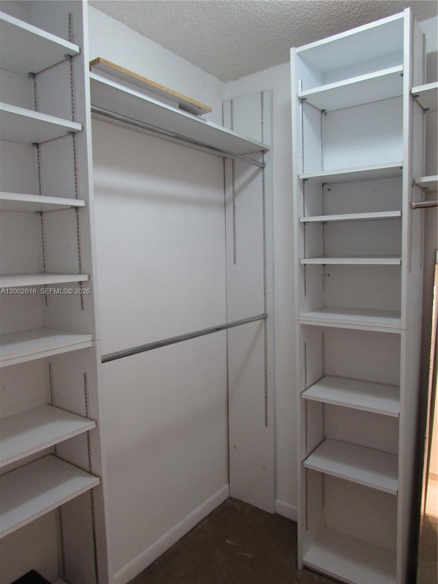5555 Ludlam Road, Unit 23 South Miami, FL 33155 - Photo 8 of 25 a view of an empty walk in closet