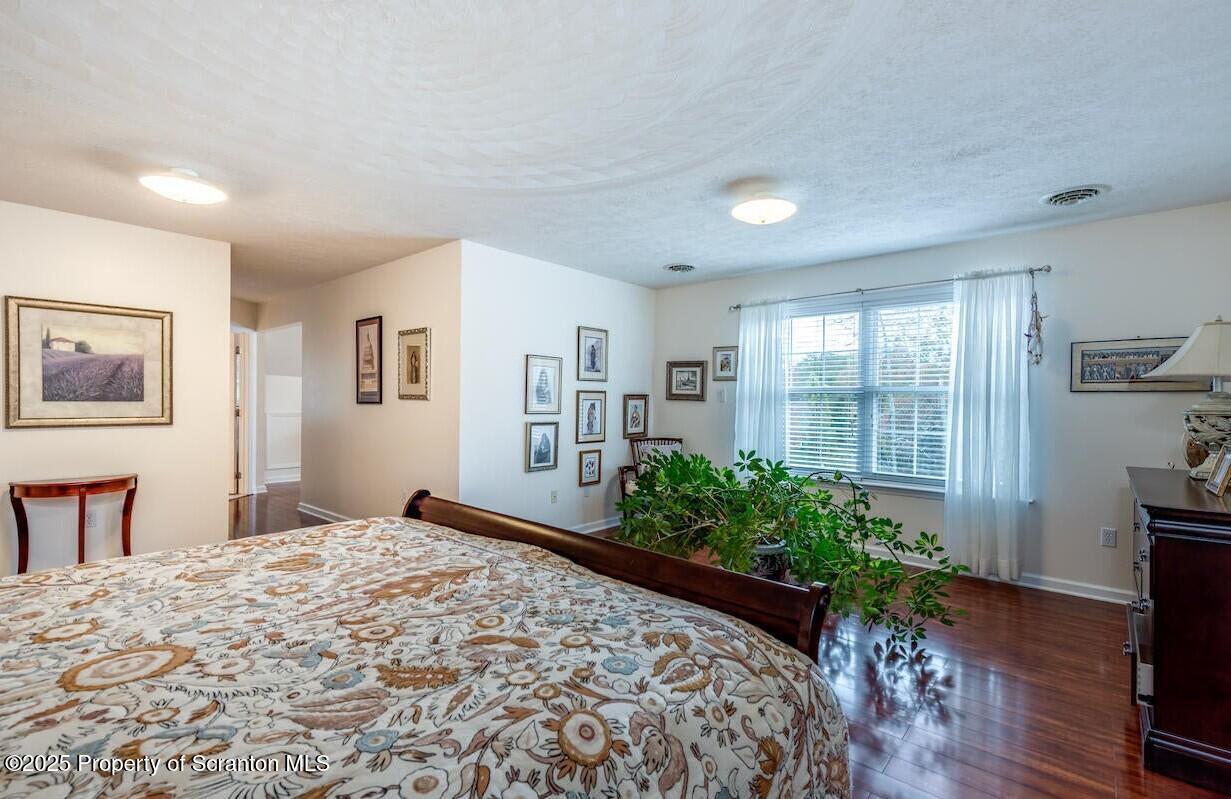 1300 Sandspring Road Wilkes Barre, PA 18702 - Photo 15 of 26 a bed room with a bed and a potted plant