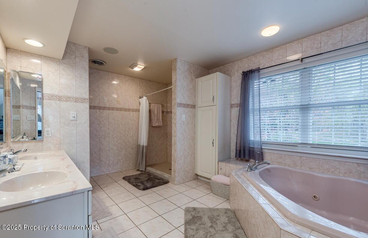 1300 Sandspring Road Wilkes Barre, PA 18702 - Photo 16 of 26 a bathroom with a sink a toilet and bathtub
