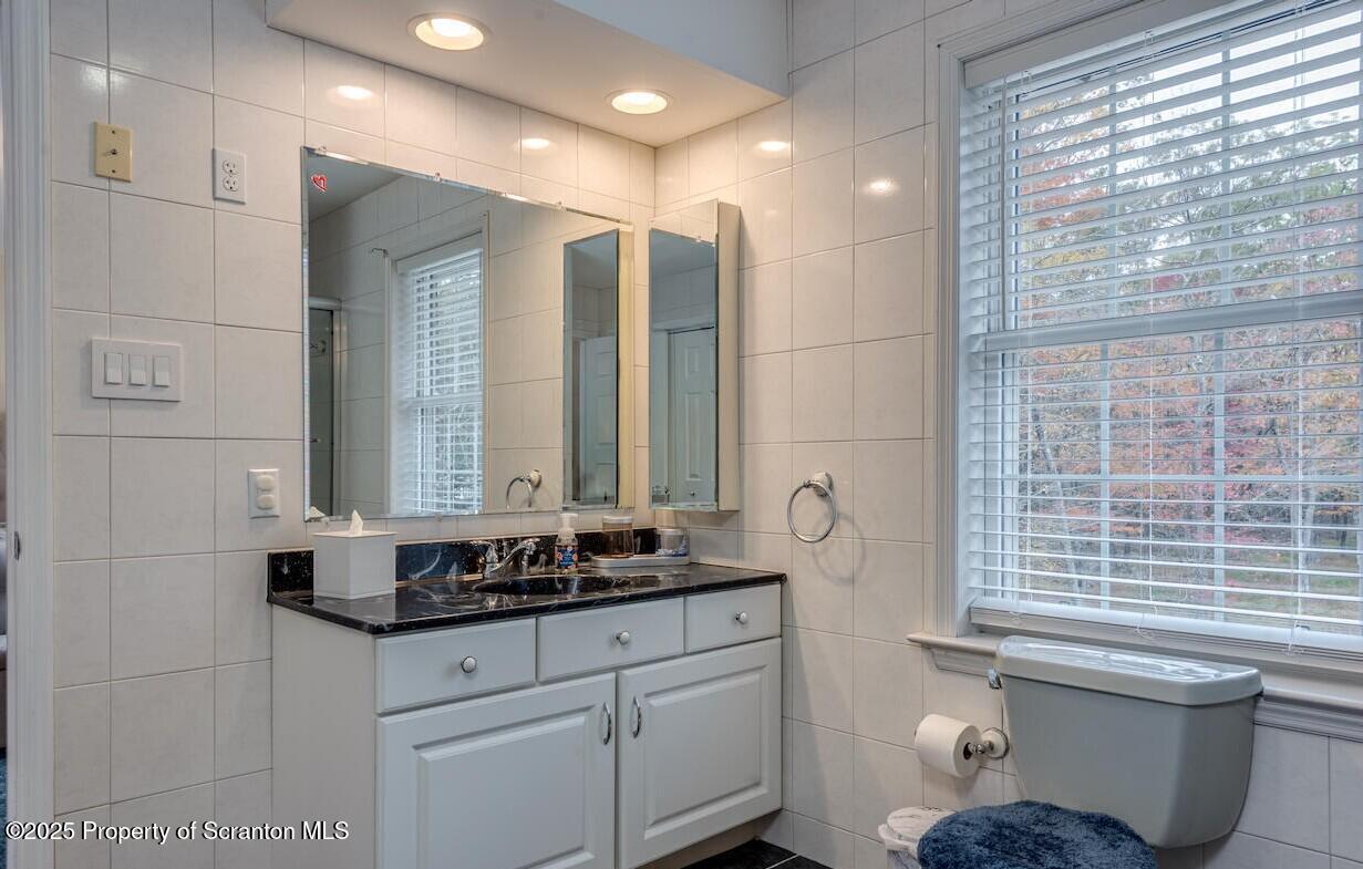 1300 Sandspring Road Wilkes Barre, PA 18702 - Photo 21 of 26 a bathroom with a granite countertop sink and a mirror