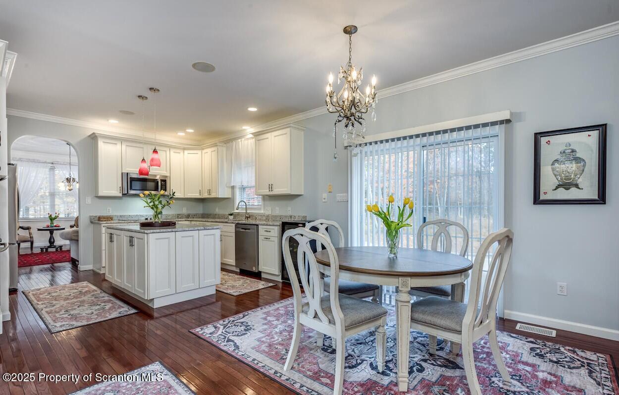 1300 Sandspring Road Wilkes Barre, PA 18702 - Photo 7 of 26 a view of a dining room with furniture and a chandelier