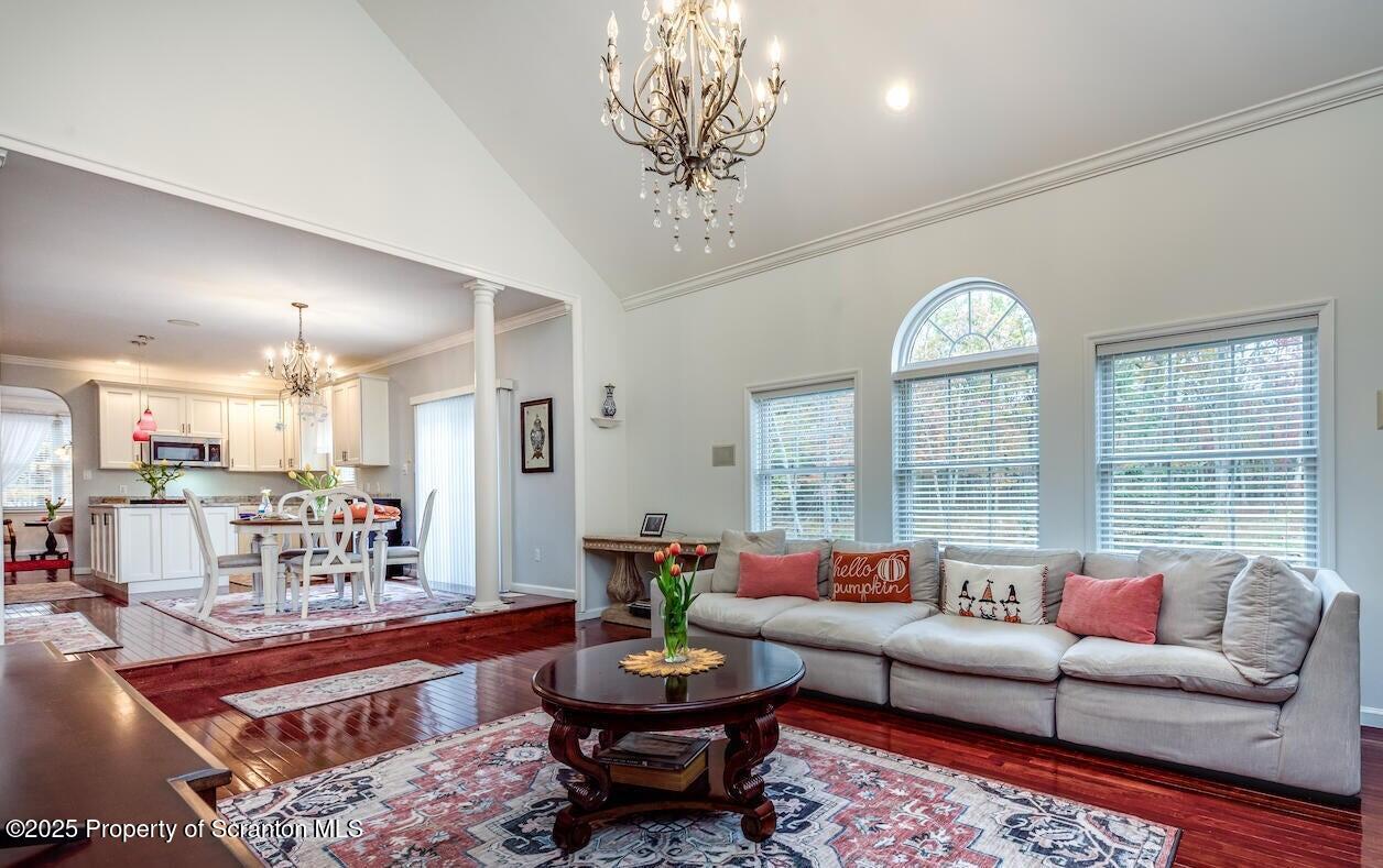 1300 Sandspring Road Wilkes Barre, PA 18702 - Photo 8 of 26 a living room with furniture a chandelier and a table