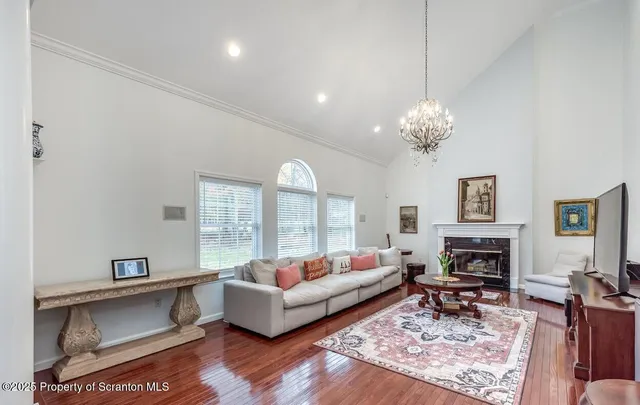 a living room with furniture fireplace and window