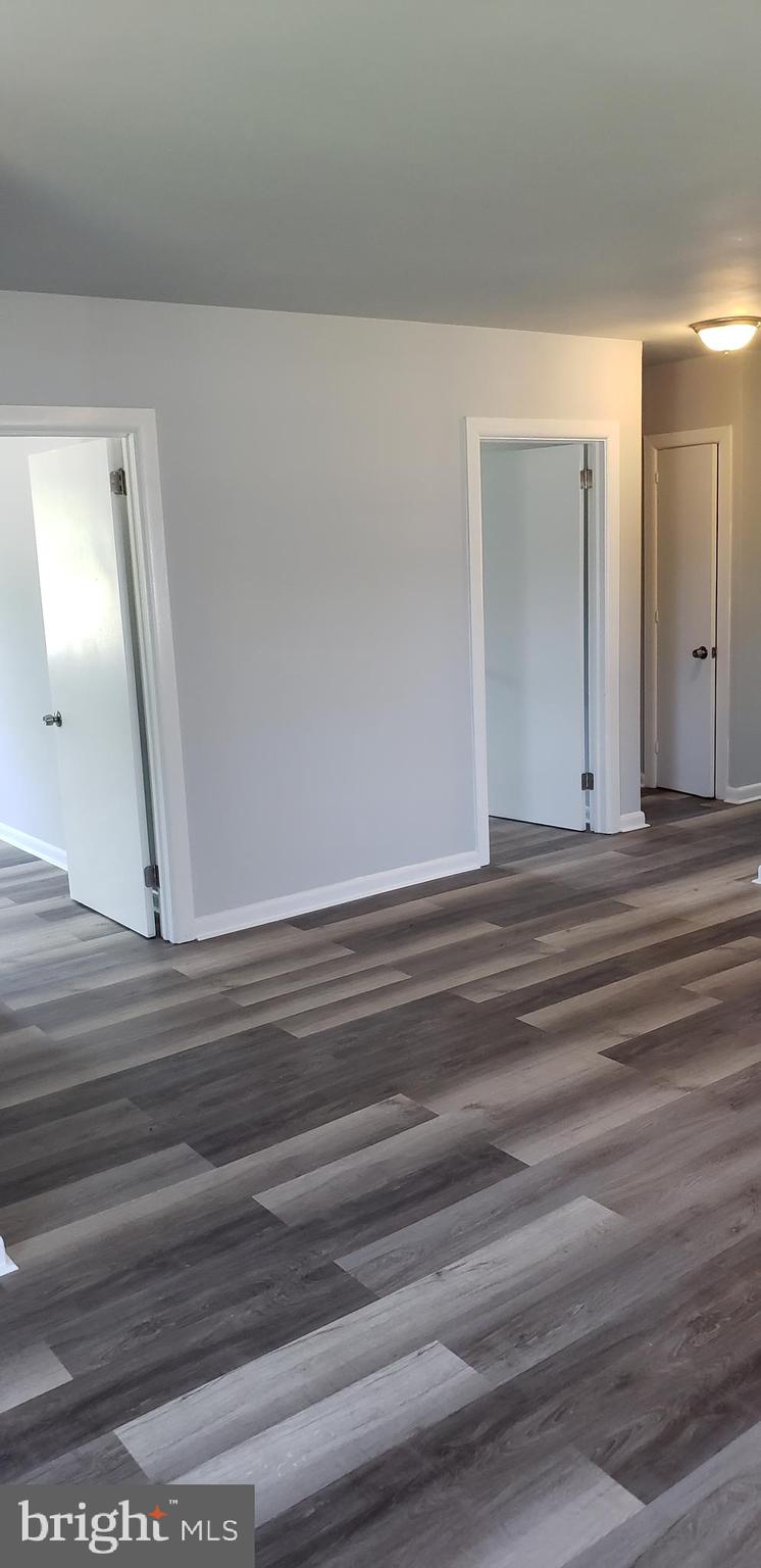 5344 Bucktown Road Cambridge, MD 21613 - Photo 11 of 15 Great room towards front and middle bedroom, bath