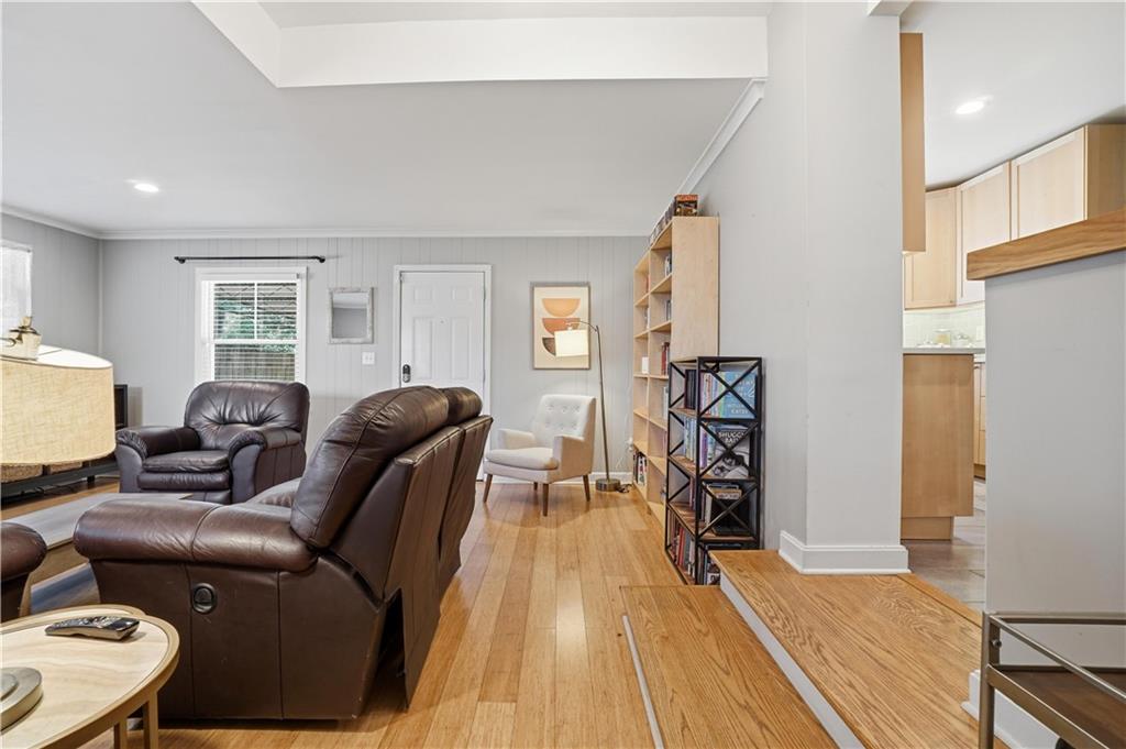1394 North Druid Hills Road Northeast Brookhaven, GA 30319 - Photo 11 of 38 a living room with furniture and a wooden floor