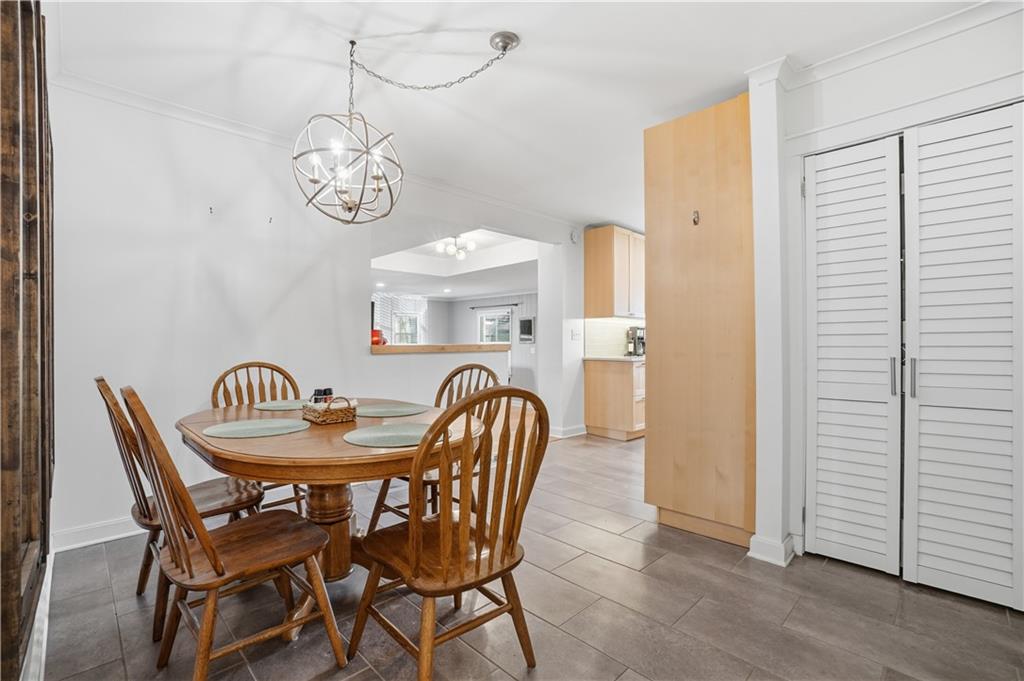 1394 North Druid Hills Road Northeast Brookhaven, GA 30319 - Photo 11 of 38 a view of a dining room with furniture window and wooden floor