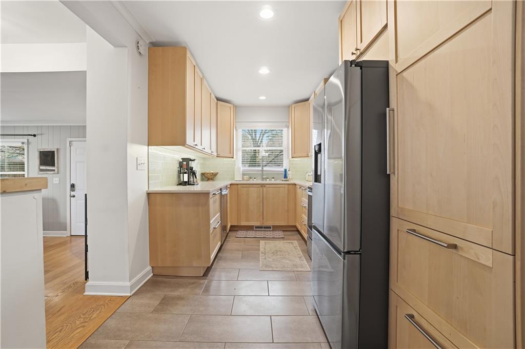 1394 North Druid Hills Road Northeast Brookhaven, GA 30319 - Photo 12 of 38 a kitchen with stainless steel appliances granite countertop a refrigerator and a sink