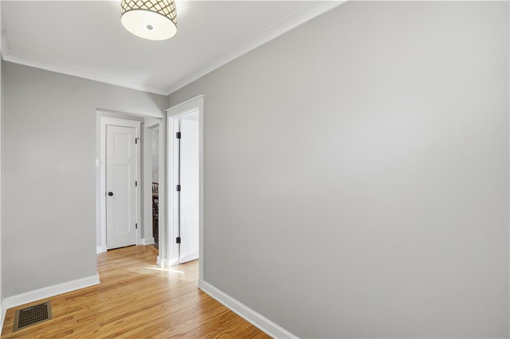 1394 North Druid Hills Road Northeast Brookhaven, GA 30319 - Photo 14 of 38 a view of an empty room and wooden floor