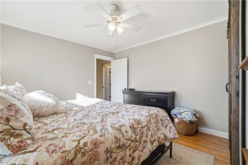 1394 North Druid Hills Road Northeast Brookhaven, GA 30319 - Photo 16 of 38 a bedroom with a bed and a chandelier