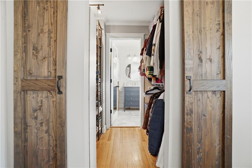 1394 North Druid Hills Road Northeast Brookhaven, GA 30319 - Photo 17 of 38 a view of walk in closet with clothes