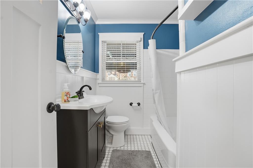 1394 North Druid Hills Road Northeast Brookhaven, GA 30319 - Photo 20 of 38 a bathroom with a sink toilet and window