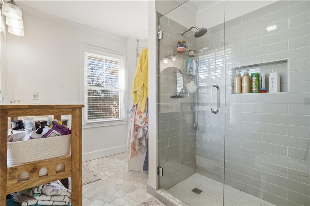 1394 North Druid Hills Road Northeast Brookhaven, GA 30319 - Photo 25 of 38 a bathroom with a shower and a sink