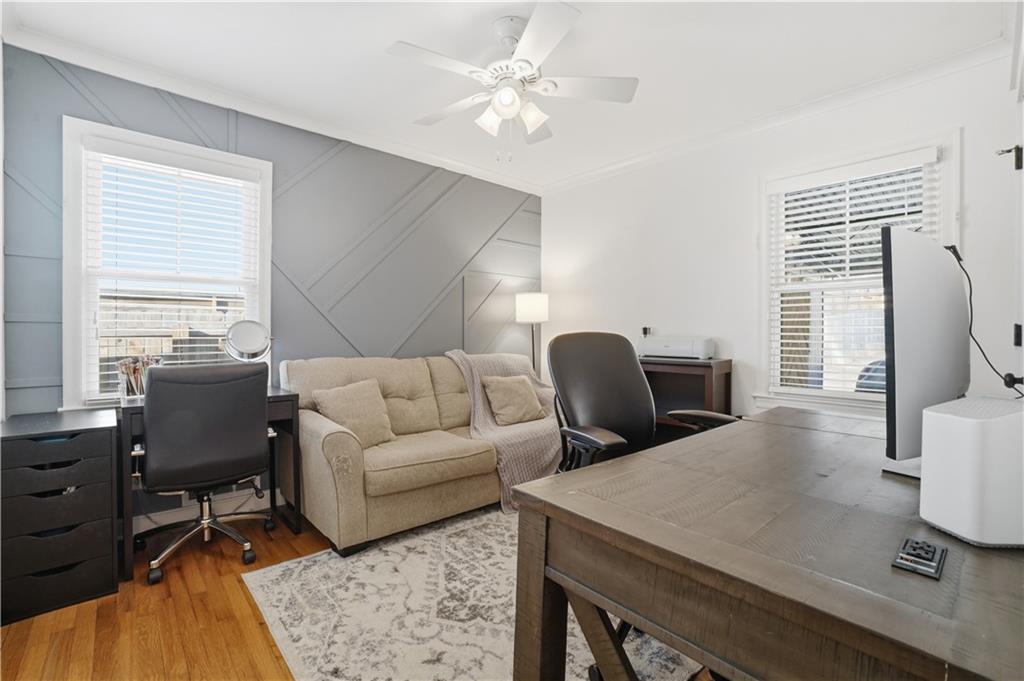 1394 North Druid Hills Road Northeast Brookhaven, GA 30319 - Photo 28 of 38 a living room with furniture a flat screen tv and a window