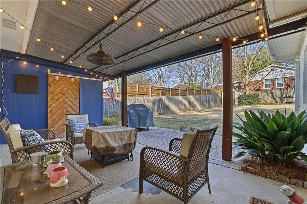 1394 North Druid Hills Road Northeast Brookhaven, GA 30319 - Photo 30 of 38 a building outdoor space with patio furniture and potted plants