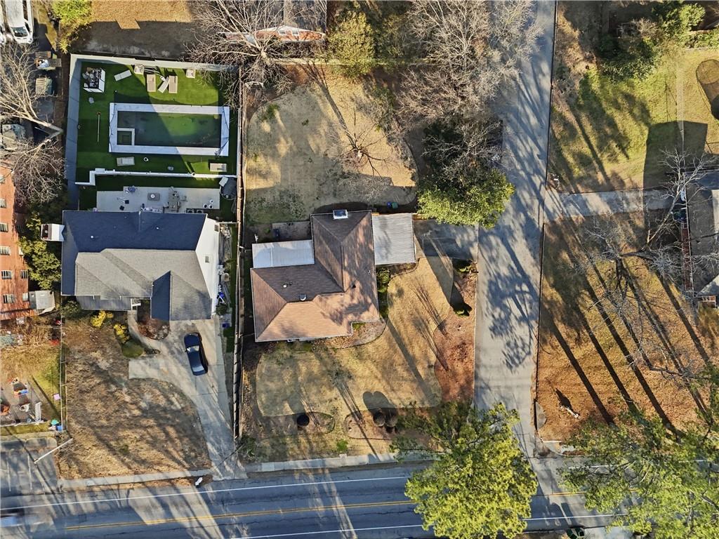 1394 North Druid Hills Road Northeast Brookhaven, GA 30319 - Photo 37 of 38 a front view of a house with a yard