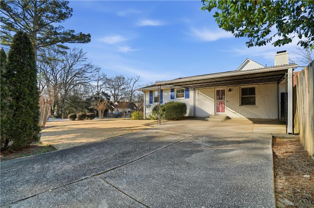 1394 North Druid Hills Road Northeast Brookhaven, GA 30319 - Photo 6 of 38 a view of a house with backyard and trees