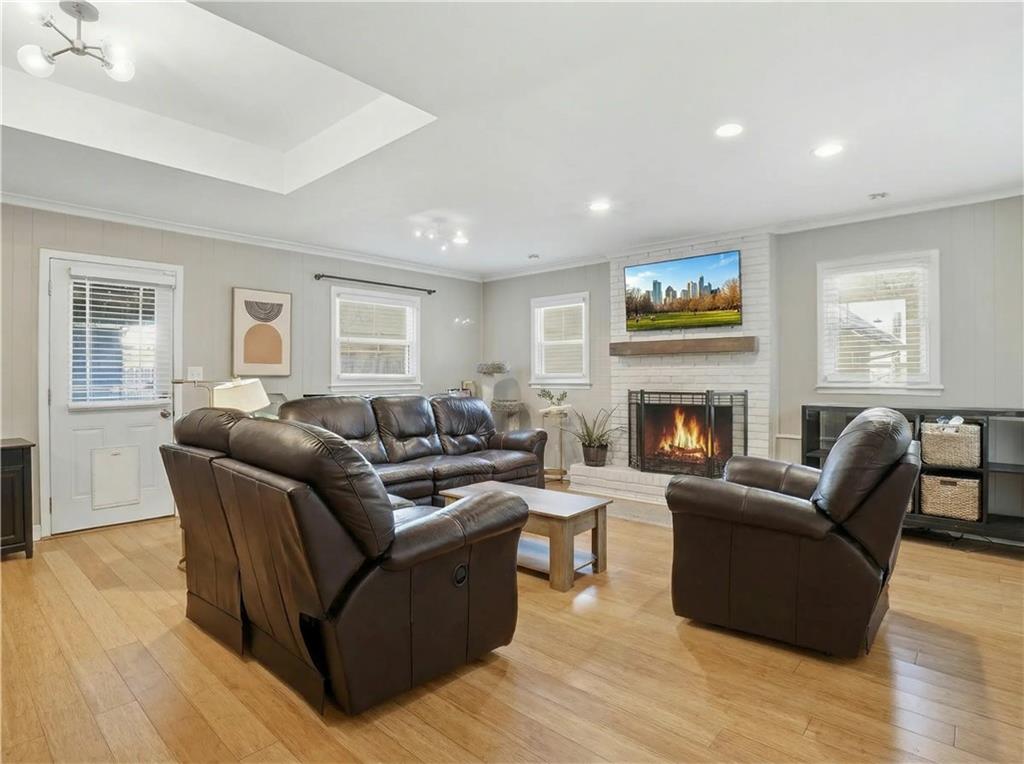 1394 North Druid Hills Road Northeast Brookhaven, GA 30319 - Photo 7 of 38 a living room with furniture and a fireplace