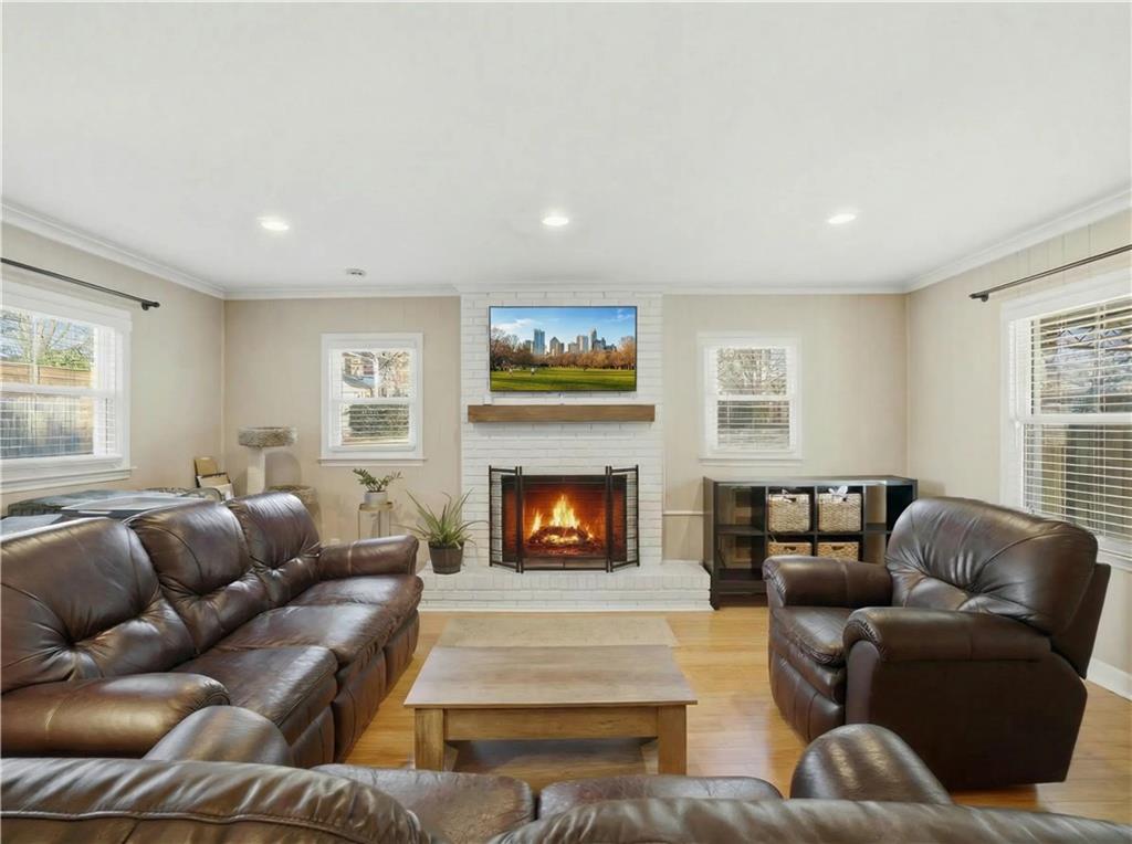 1394 North Druid Hills Road Northeast Brookhaven, GA 30319 - Photo 8 of 38 a living room with furniture and a fireplace