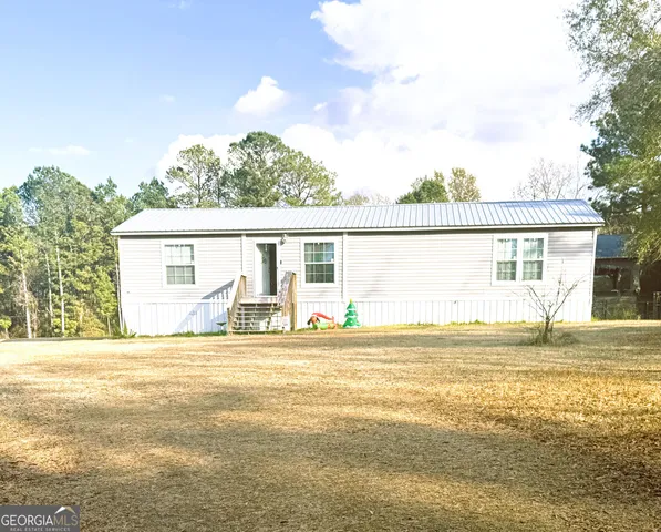 a view of a house with a ocean view
