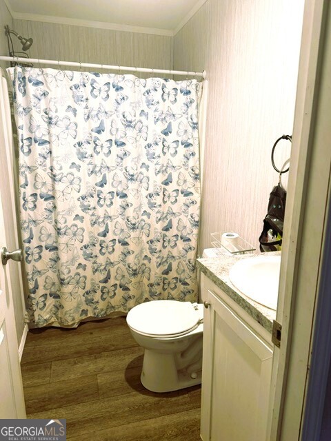 105 Dowdy Court Perry, GA 31069 - Photo 5 of 12 a bathroom with a granite countertop toilet and a sink