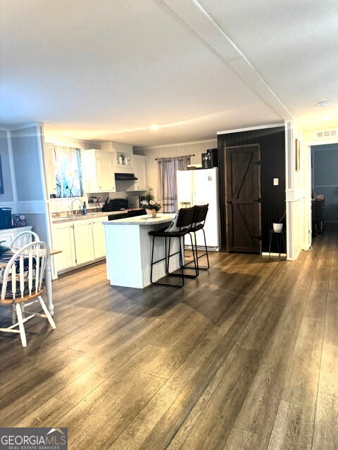 105 Dowdy Court Perry, GA 31069 - Photo 6 of 12 a kitchen with stainless steel appliances kitchen island granite countertop a sink and cabinets